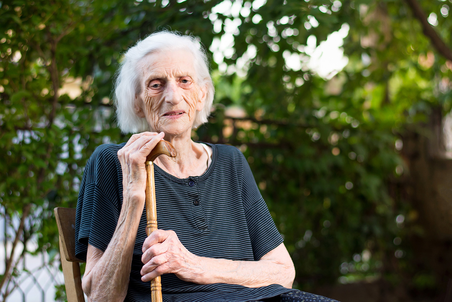 a older woman with a cain