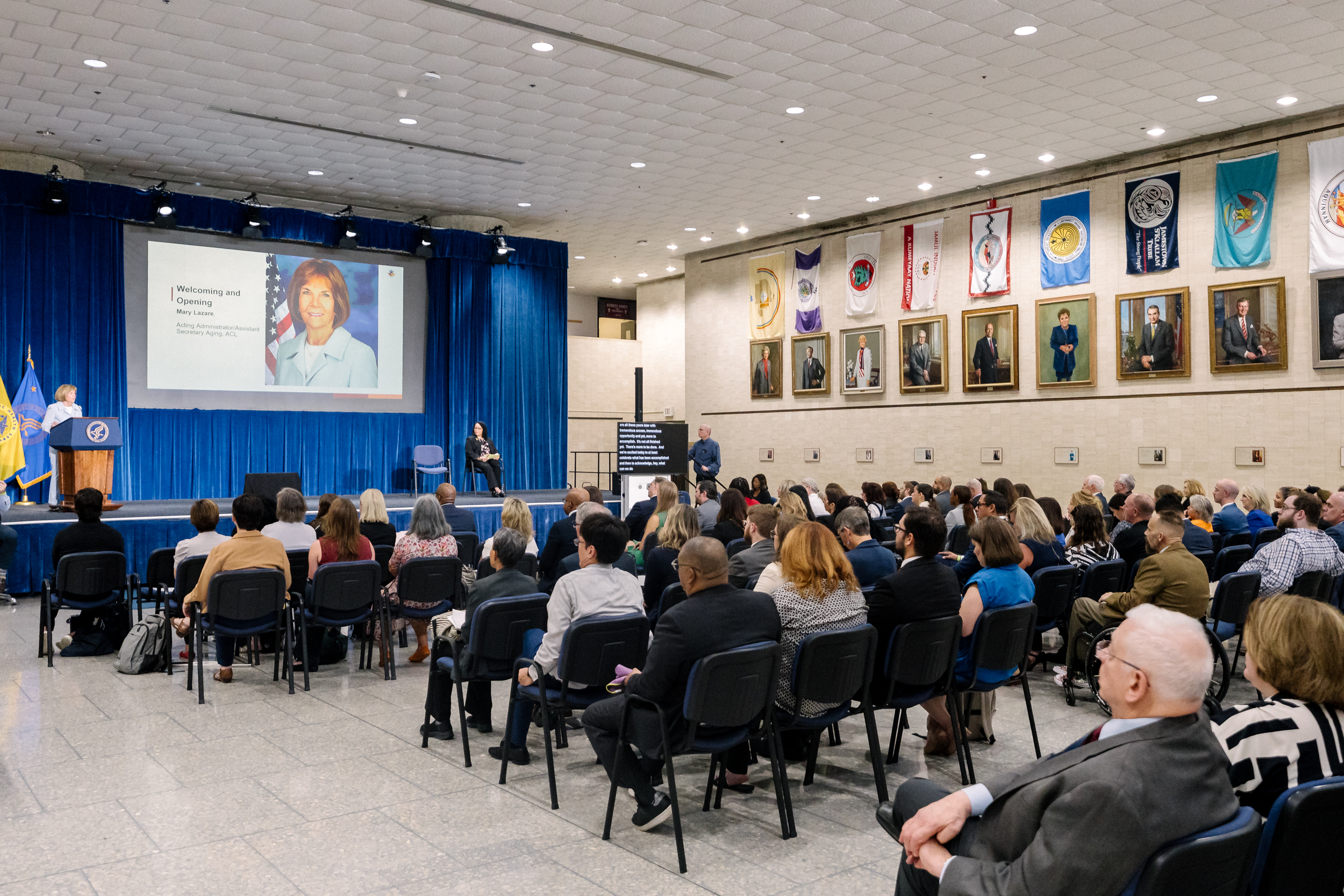 ACL's Acting Administrator and Assistant Secretary for Aging Mary Lazare speaking in front of a full Great Hall at HHS during the ADA 35th Anniversary event