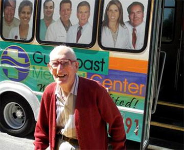 Photo of Senior man exiting a bus